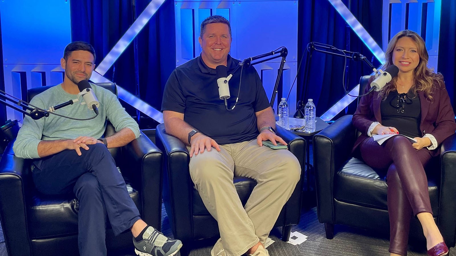 Skylar Richards, Dr. Shawn Stafford, and Dr. Haifa Maamar sit in a recording studio. They each have a microphone in front of them.