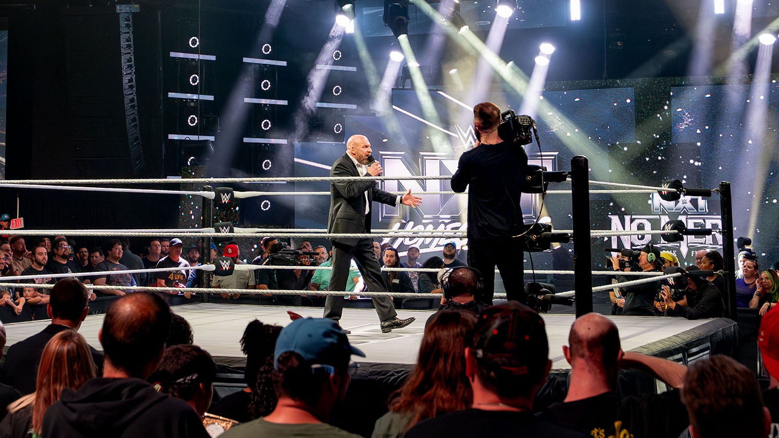 Fans fill Full Sail Live as Triple H addresses the crowd during WWE’s ‘NXT Homecoming’ event.