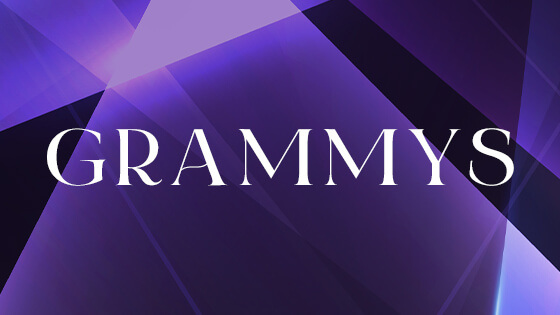 A black and purple background with the word Grammys overlaid in white text.