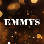 The word 'EMMYS' appears in block white text over a dark, blurred scene filled with warm, glowing lights in shades of gold, orange, and brown.