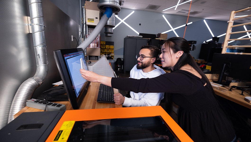 Students collaborate on a project in the Fab Lab, using design software and advanced fabrication tools.