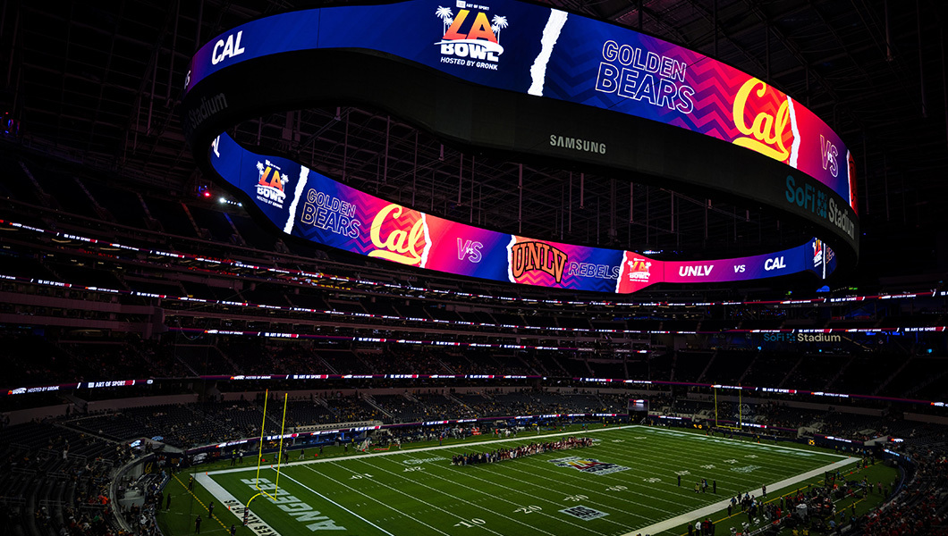 A wide stadium shot of the LA Bowl at SoFi Stadium, featuring Cal Golden Bears vs UNLV Rebels on the massive scoreboard.